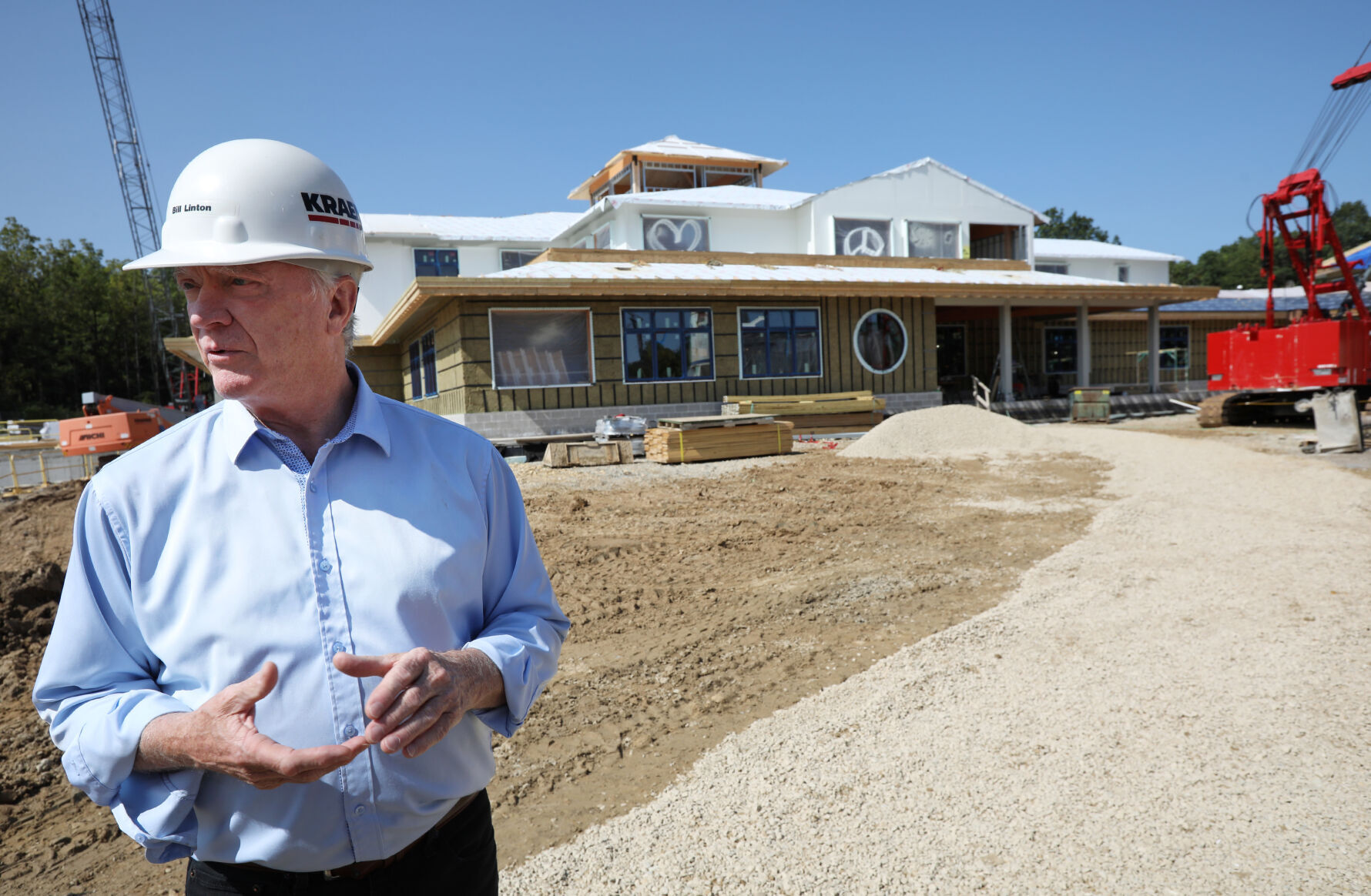 Bill Linton in front of new building